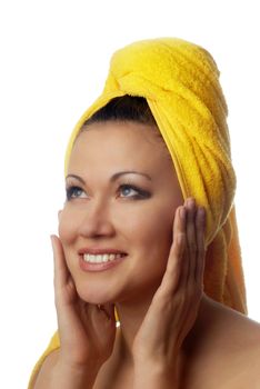 Photo of smiling model with yellow towel after shower