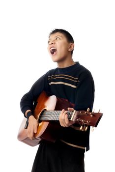 Boy playing guitar and singing a rock song