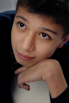 Boy lying on the table with pleasant dreams