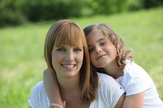 Mother and daughter outdoors