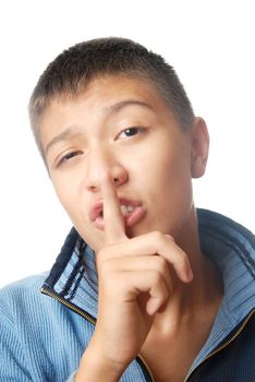 Teenager with finger on his lips