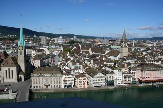 Zurich cityscape. Fraumuenster on the left, St. Peter's Church on the right. Limmat river.