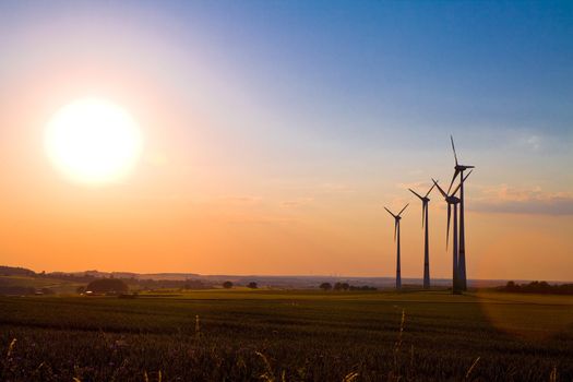 Windmills at sunset, alternative energy source