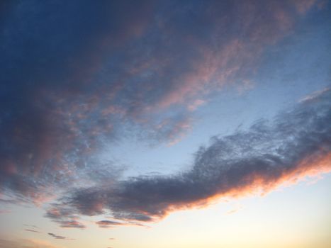 Evening landscape with beautiful picturesque clouds