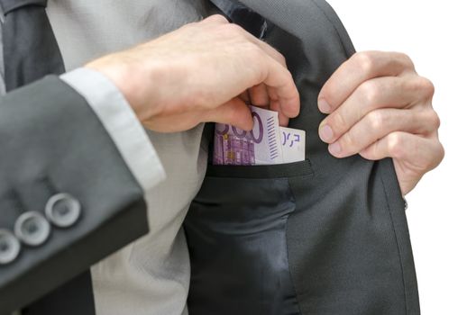 Closeup of a business man in suit putting banknotes in his jacket pocket.