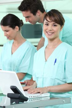 Nurses using a computer