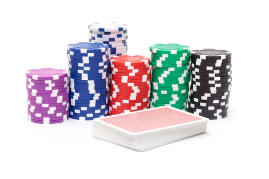 Stacks of Poker Chips with Playing Cards, closeup on white background