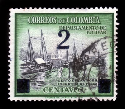 COLOMBIA - CIRCA 1970: A stamp printed in Colombia shows fishing boats in port of Cartagena, circa 1970