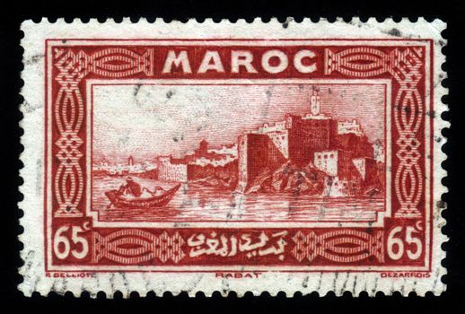 MOROCCO - CIRCA 1934: A stamp printed in Morocco shows capital city of Rabat on the Atlantic coast, red, circa 1934