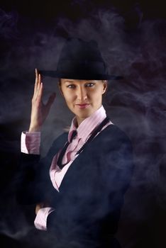 Photo of American blonde in gangster suit and hat with smoke