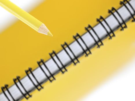 close up of yellow pencil and notepad