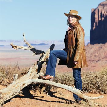 portrait of cowgirl at Monument Valley, western movie style