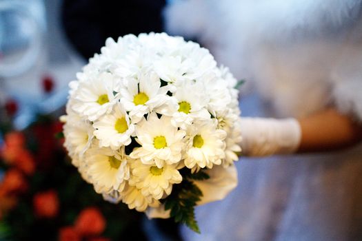 bouquet of chamomiles of the bride