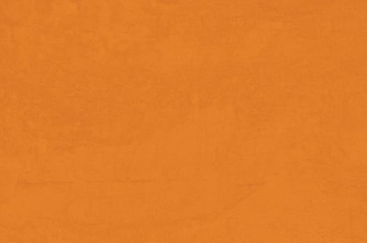 detail of cob wall with orange color and brushed