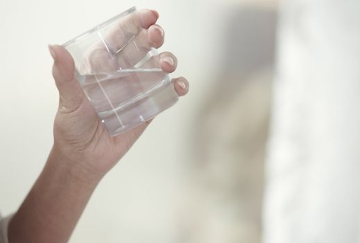 Woman holding glass with potable water