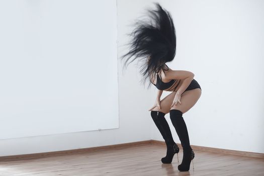 Woman performing seductive dance in ball room