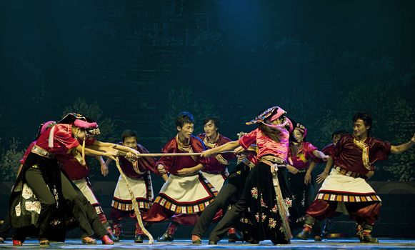 CHENGDU - SEP 27: chinese Tibetan ethnic dancers perform on stage at Sichuan experimental theater.Sep 27,2010 in Chengdu, China.