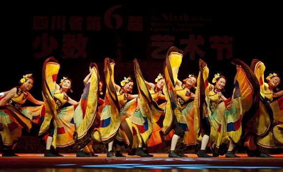CHENGDU - SEP 28: chinese Yi ethnic dancers perform on stage in the 6th Sichuan minority nationality culture festival at JINJIANG theater.Sep 28,2010 in Chengdu, China.