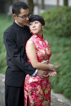 an affectionate young couple embracing before their wedding day