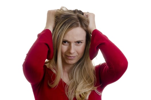 portrait of a young stressed woman pulling hair isolated on white background