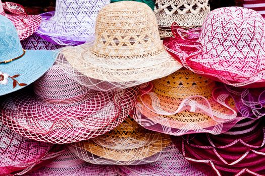 a pile of different hats