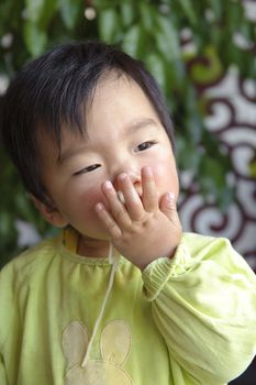 a cute baby is eating in restaurant