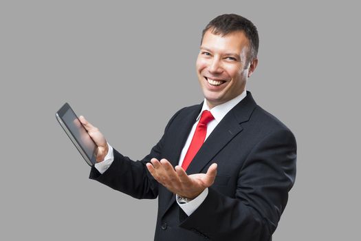 An image of a handsome business man and his tablet pc