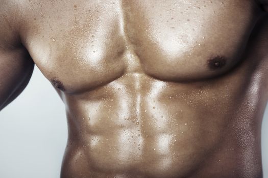 Close-up view on a muscular man's torso