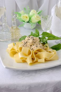 Italian pasta - Pappardelle with chicken fillet in a creamy sauce with sesame seeds