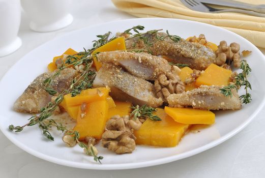 Herring in the pumpkin gratin with nut sauce