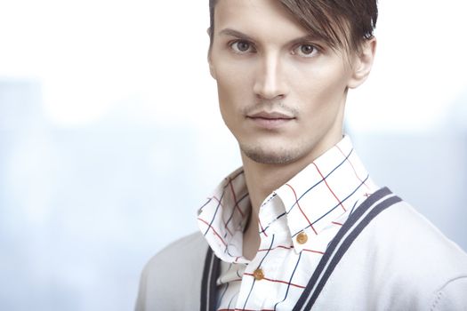 Attractive young man in modern clothes at his office