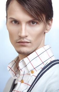 Attractive young man in modern clothes at his office