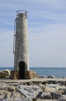 Little lighthouse in the beach of Marbella, Andalusia, Spain