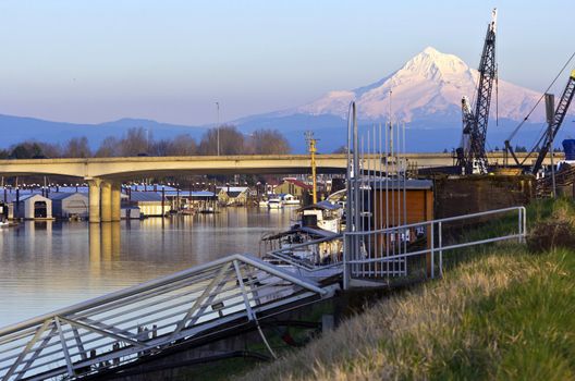 Mt. Hood and urban surroundings on a river Portland OR.