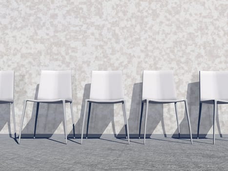 Several white chairs against the wall in a waiting room