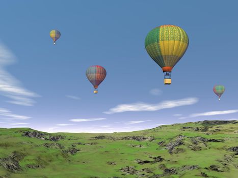 Several colorful balloons flying in the blue sky upon green grassland