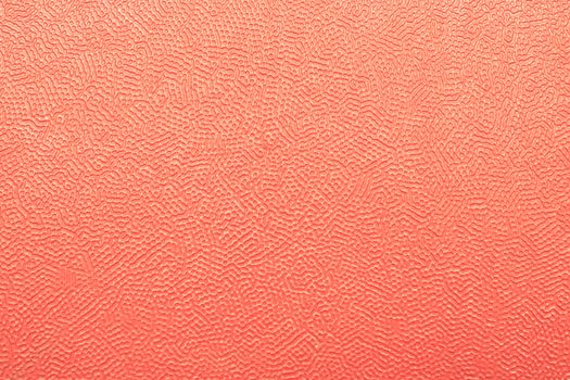 Grainy red plastic sheet as a detailed background image