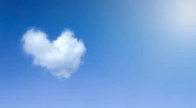 Heart cloud symbol whit blue sky background