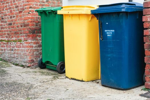 Three recycling bins outside a house in UK