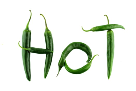 Hot word made from Green hot chili pepper on white background with a clipping path