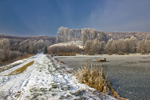 Frozen lake winter landscape in Croatia, Prigorje region