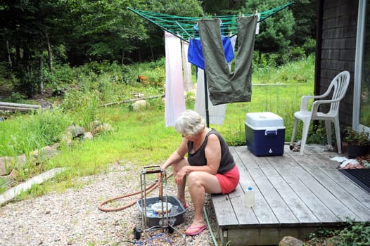 Mature female working outside.