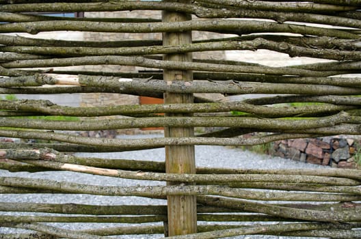closeup wicker weave wooden twig fence background.
