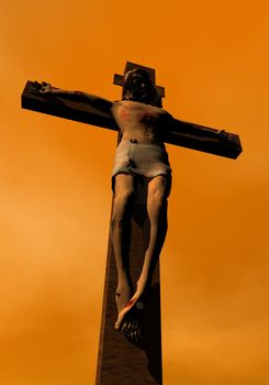 Shadow of Jesus-Christ on the cross by sunset colorful background sky