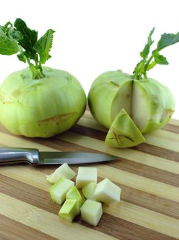 Cabbage kohlrabi on Wooden Kitchen Board with knife.