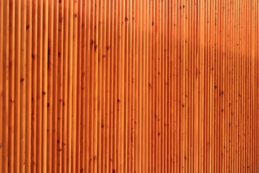 Close up of a wall made of vertical pieces of wood