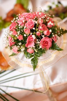 unusual bouquet of small pink roses