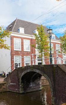 Beautiful view of channels in Delft (Netherlands) in sunny autumn day