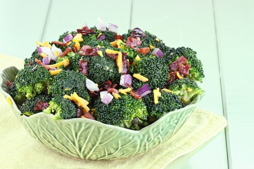 Broccoli made with fresh broccoli, cheddar cheese, red onion, bacon with mayonnaise, sugar and vinegar dressing.
