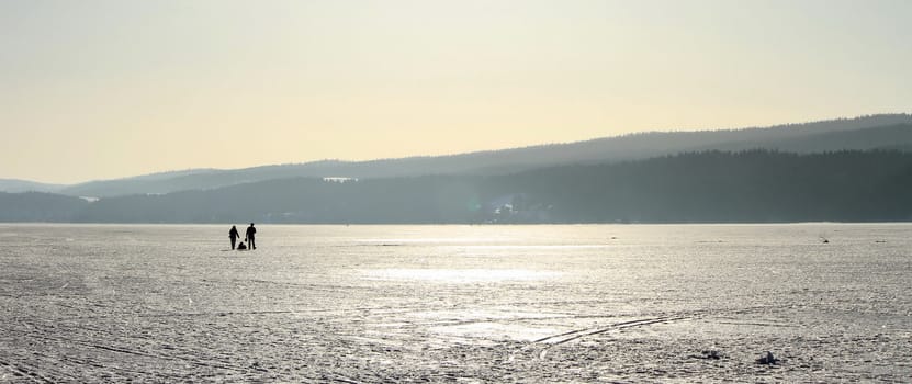 Panoramic view on the frozen lake of the Joux valley by winter day, Vaud canton, Switzerland